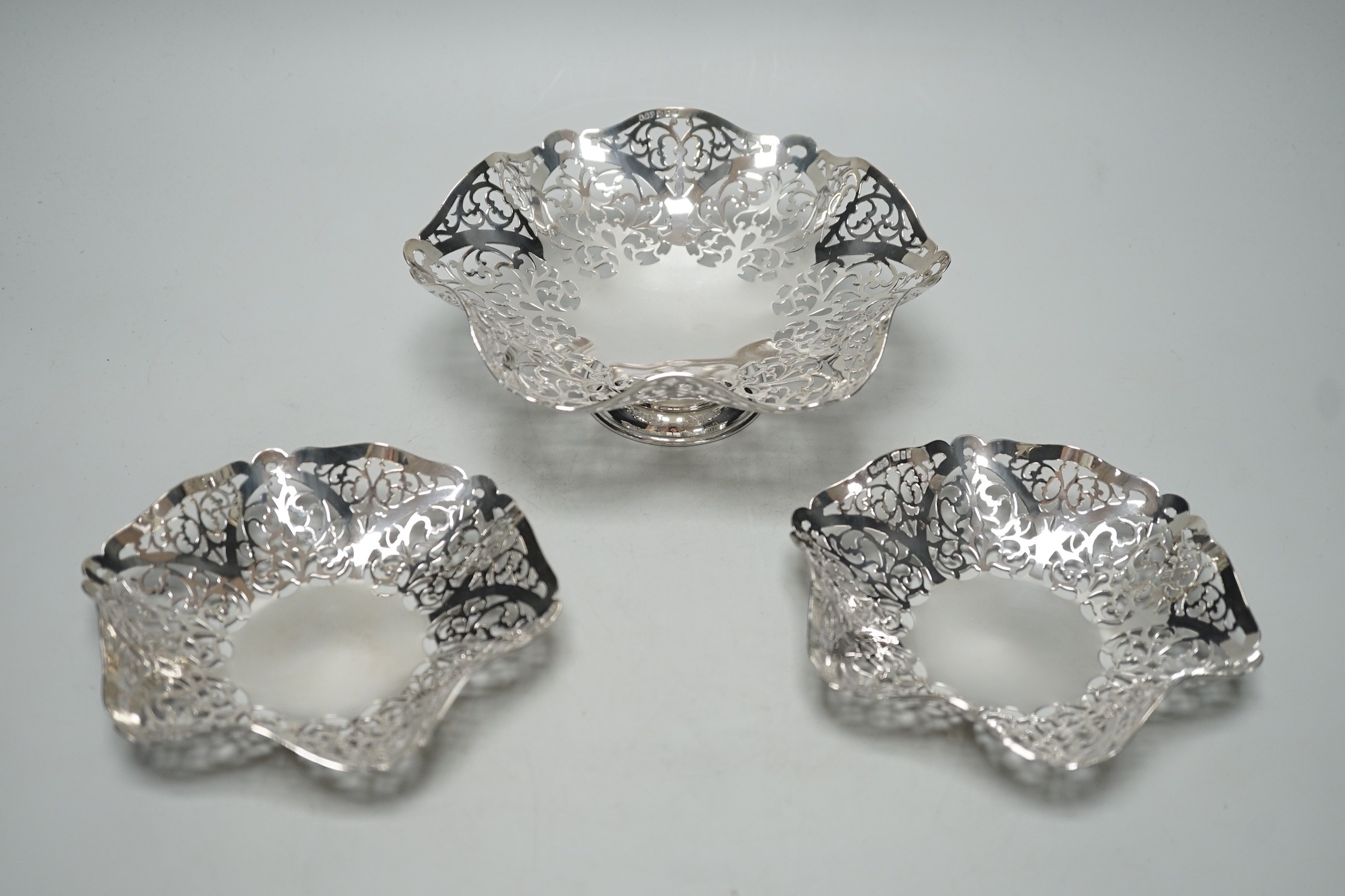 A modern suite of three Elizabeth II graduated pierced silver bonbon dishes, A. Taite & Sons Ltd, London, 1961, largest diameter 16.5cm, 11.9oz.